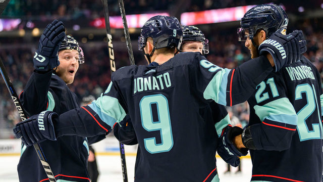 SEATTLE, WASHINGTON - JANUARY 19: Ryan Donato #9 celebrates his goal with Alex Wennberg #21, Will Borgen #3 and Jared McCann #19 of the Seattle Kraken during the first period of a game against the New Jersey Devils at Climate Pledge Arena on January 19, 2023 in Seattle, Washington.