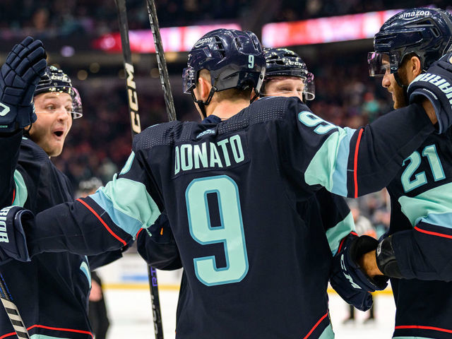 SEATTLE, WASHINGTON - JANUARY 19: Ryan Donato #9 celebrates his goal with Alex Wennberg #21, Will Borgen #3 and Jared McCann #19 of the Seattle Kraken during the first period of a game against the New Jersey Devils at Climate Pledge Arena on January 19, 2023 in Seattle, Washington.