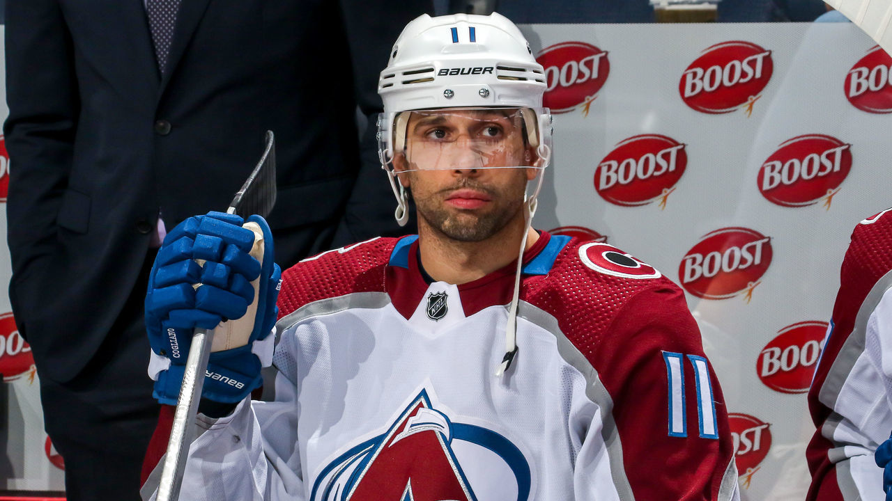 WINNIPEG, CANADA - NOVEMBER 29: Andrew Cogliano #11 of the Colorado Avalanche looks on from the bench prior to NHL action against the Winnipeg Jets at Canada Life Centre on November 29, 2022 in Winnipeg, Manitoba, Canada.