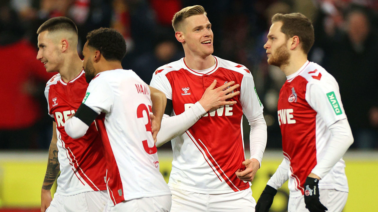 COLOGNE, GERMANY - JANUARY 21: Steffen Tigges of 1.FC Koln celebrates with teammates after scoring the team's second goal during the Bundesliga match between 1. FC Köln and SV Werder Bremen at RheinEnergieStadion on January 21, 2023 in Cologne, Germany.