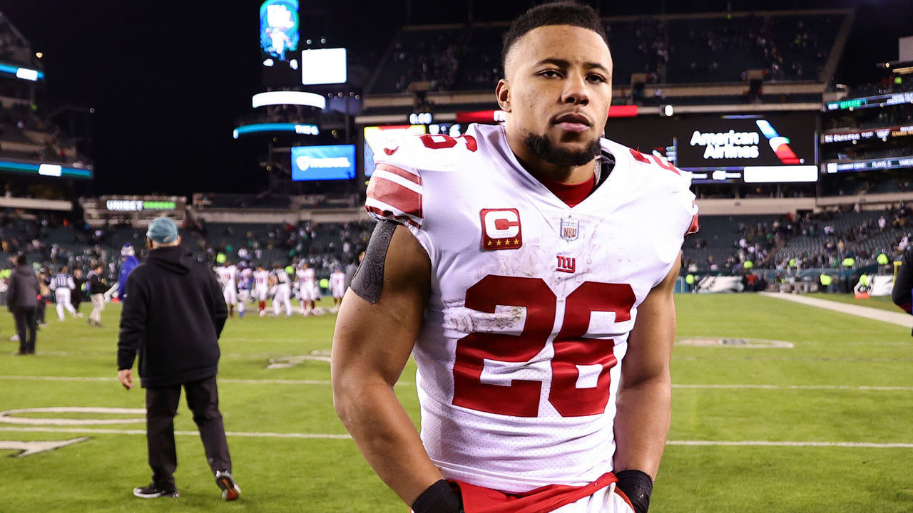 PHILADELPHIA, PENNSYLVANIA - JANUARY 21: Saquon Barkley #26 of the New York Giants walks off the field after losing to the Philadelphia Eagles 38-7 in the NFC Divisional Playoff game at Lincoln Financial Field on January 21, 2023 in Philadelphia, Pennsylvania.