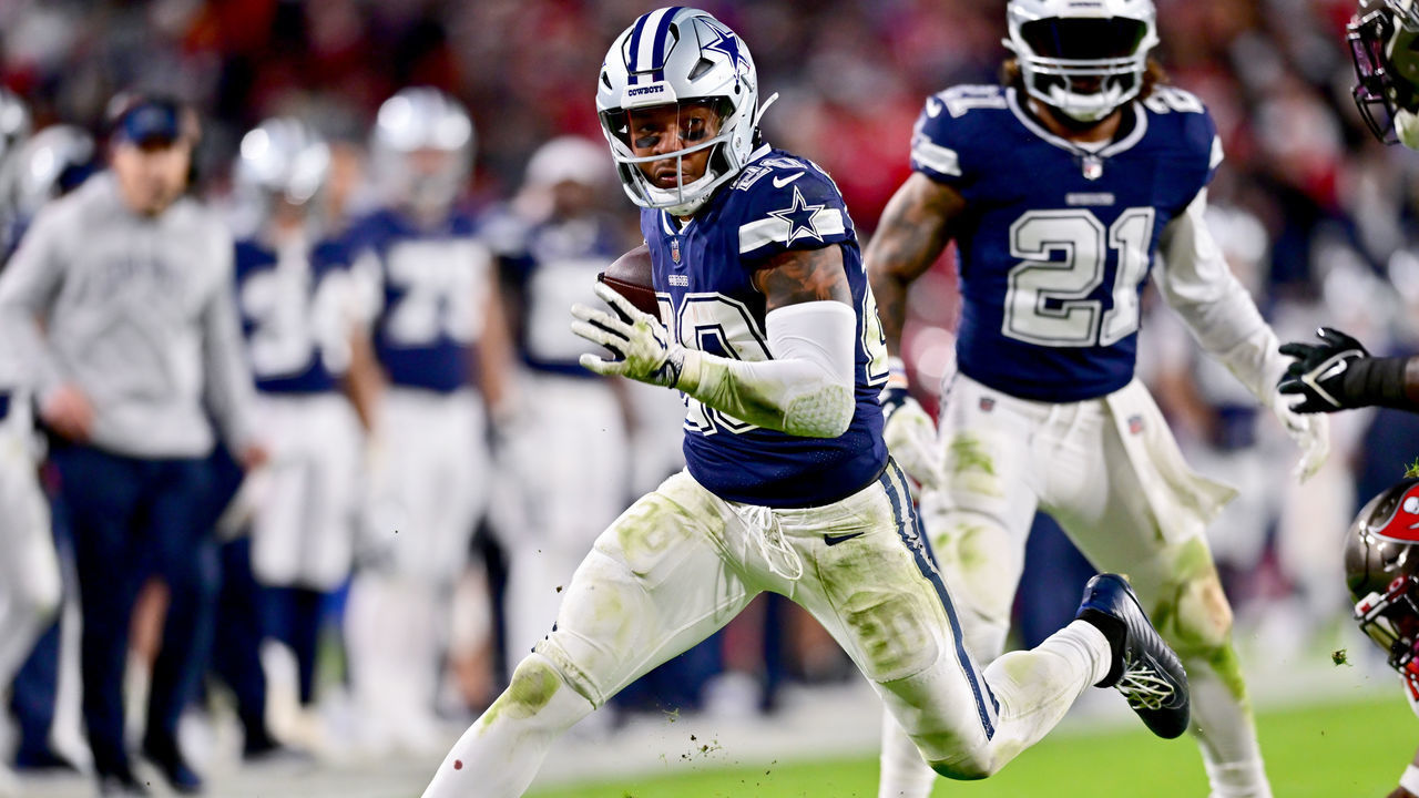 TAMPA, FLORIDA - JANUARY 16: Tony Pollard #20 of the Dallas Cowboys carries the ball against the Tampa Bay Buccaneers during the third quarter in the NFC Wild Card playoff game at Raymond James Stadium on January 16, 2023 in Tampa, Florida.