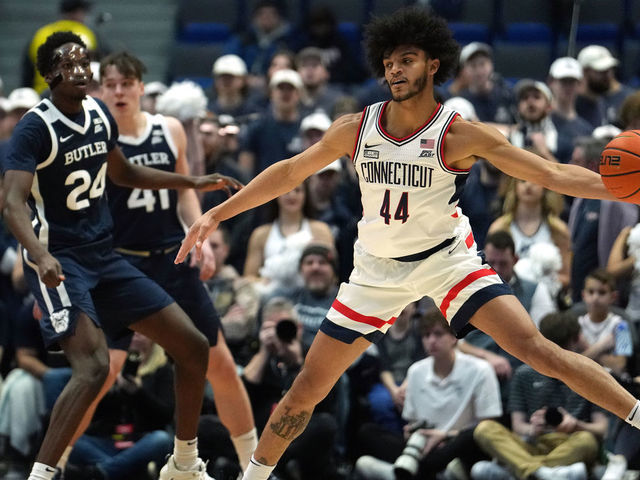 HARTFORD, CONNECTICUT - JANUARY 22: Andre Jackson Jr. #44 of the UConn Huskies gets the pass against Ali Ali #24 of the Butler Bulldogs during the first half of an NCAA college basketball game on January 22, 2022 at the XL Center in Hartford, Connecticut.