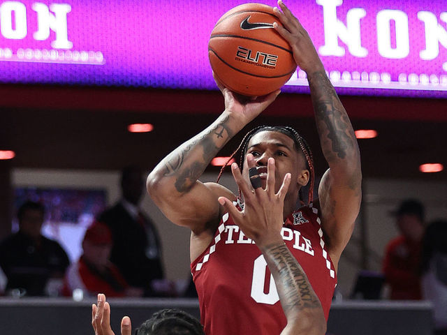 HOUSTON, TEXAS - JANUARY 22: Khalif Battle #0 of the Temple Owls shoots over Marcus Sasser #0 of the Houston Cougars during the first half at Fertitta Center on January 22, 2023 in Houston, Texas.
