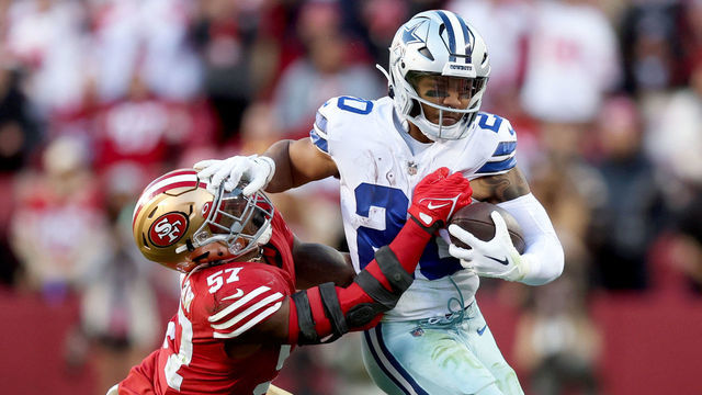 SANTA CLARA, CALIFORNIA - JANUARY 22: Tony Pollard #20 of the Dallas Cowboys carries the ball against Dre Greenlaw #57 of the San Francisco 49ers during the second quarter in the NFC Divisional Playoff game at Levi's Stadium on January 22, 2023 in Santa Clara, California.