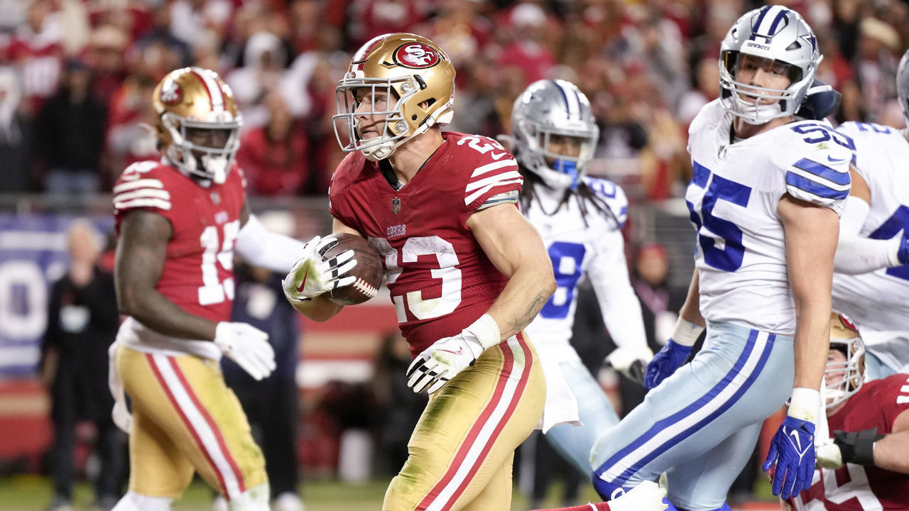 SANTA CLARA, CALIFORNIA - JANUARY 22: Christian McCaffrey #23 of the San Francisco 49ers rushes for a touchdown against the Dallas Cowboys during the fourth quarter in the NFC Divisional Playoff game at Levi's Stadium on January 22, 2023 in Santa Clara, California.