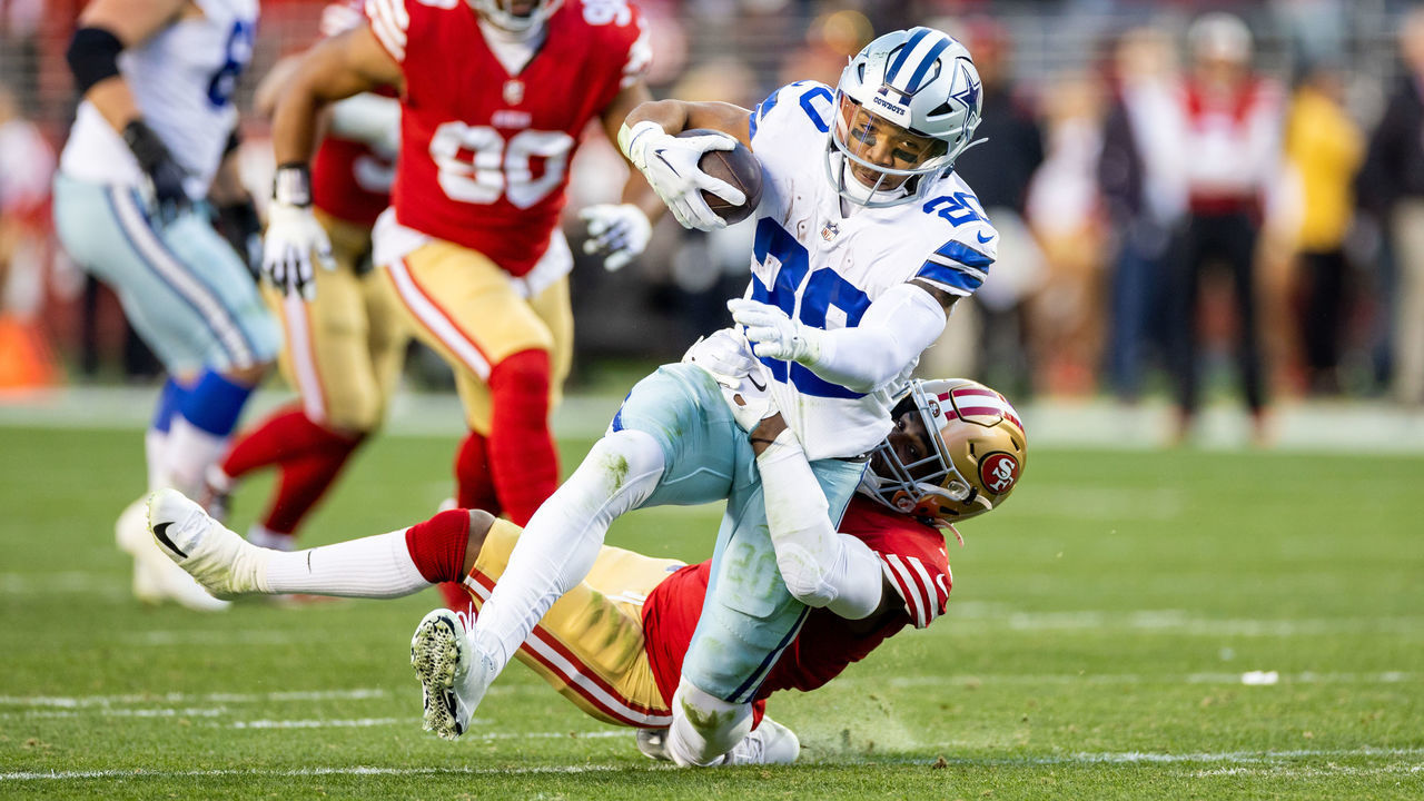 SANTA CLARA, CA - JANUARY 22: Dallas Cowboys running back Tony Pollard (20) is tackled and twists his ankle during the NFL NFC Divisional Playoff game between the Dallas Cowboys and San Francisco 49ers on January 22, 2023, at Levis Stadium in Santa Clara, CA.