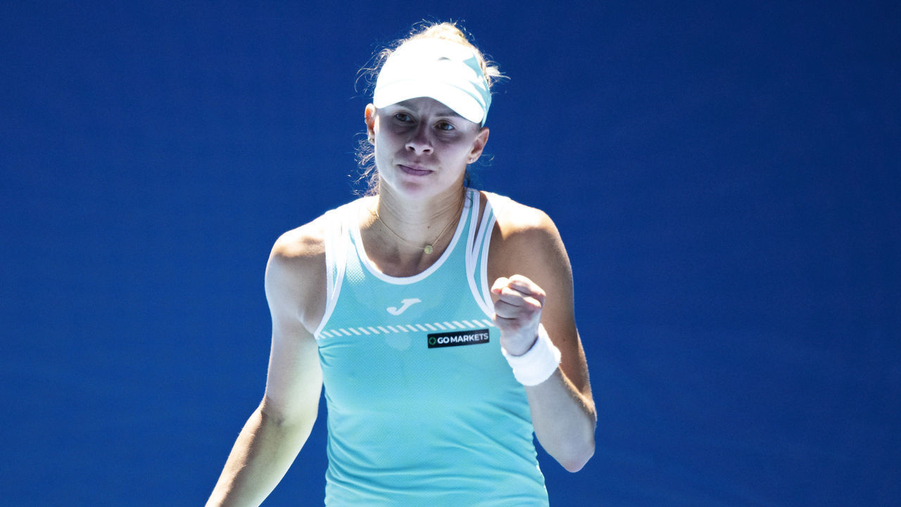 MELBOURNE, AUSTRALIA - JANUARY 23: Magda Linette of Poland reacts the fourth round singles match against Caroline Garcia of France during day eight of the 2023 Australian Open at Melbourne Park on January 23, 2023 in Melbourne, Australia.