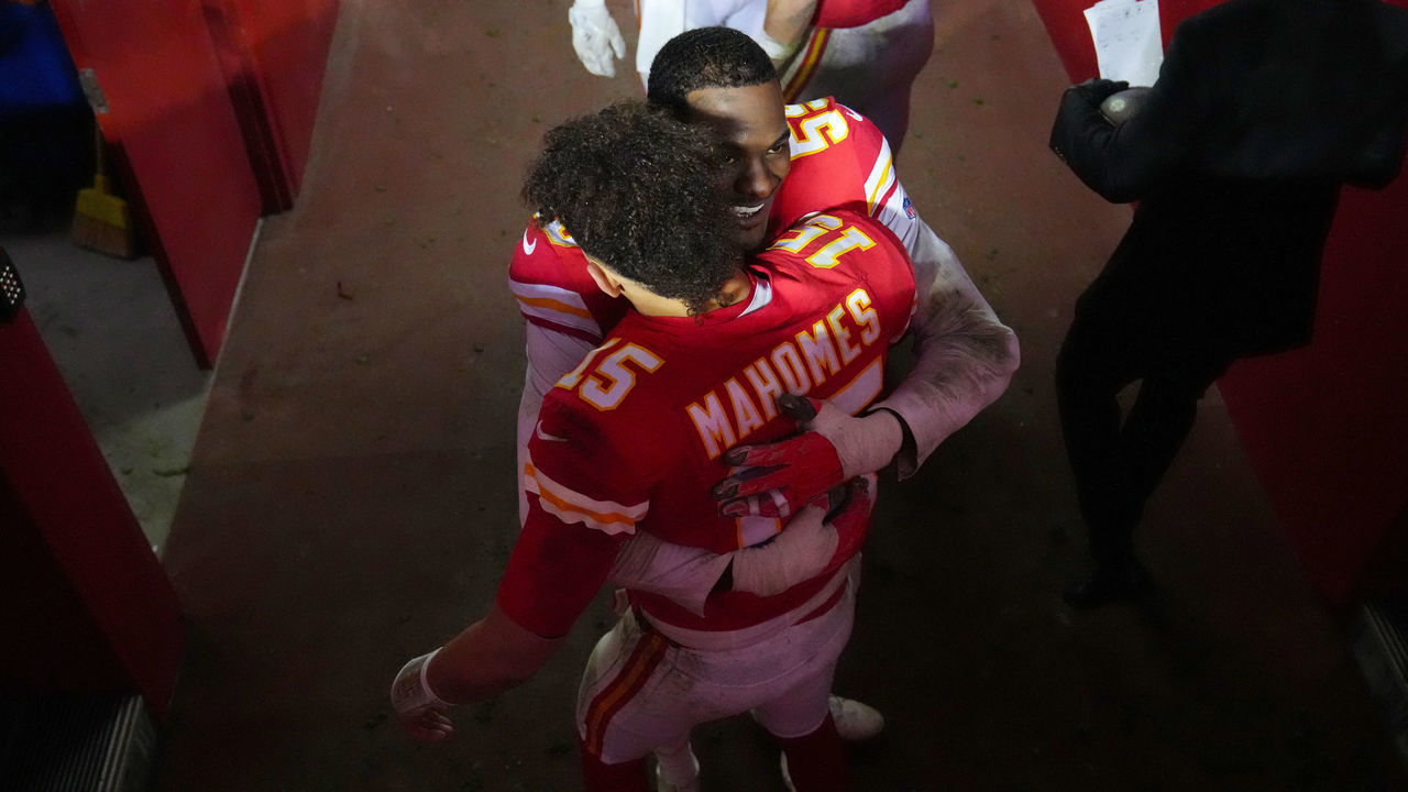 KANSAS CITY, MISSOURI - JANUARY 21: Patrick Mahomes #15 and Frank Clark #55 of the Kansas City Chiefs hug after defeating the Jacksonville Jaguars in the AFC Divisional Playoff game at Arrowhead Stadium on January 21, 2023 in Kansas City, Missouri. The Kansas City Chiefs defeated the Jacksonville Jaguars with a score of 27 to 20.