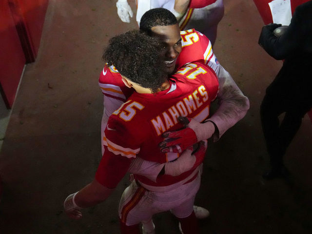 KANSAS CITY, MISSOURI - JANUARY 21: Patrick Mahomes #15 and Frank Clark #55 of the Kansas City Chiefs hug after defeating the Jacksonville Jaguars in the AFC Divisional Playoff game at Arrowhead Stadium on January 21, 2023 in Kansas City, Missouri. The Kansas City Chiefs defeated the Jacksonville Jaguars with a score of 27 to 20.