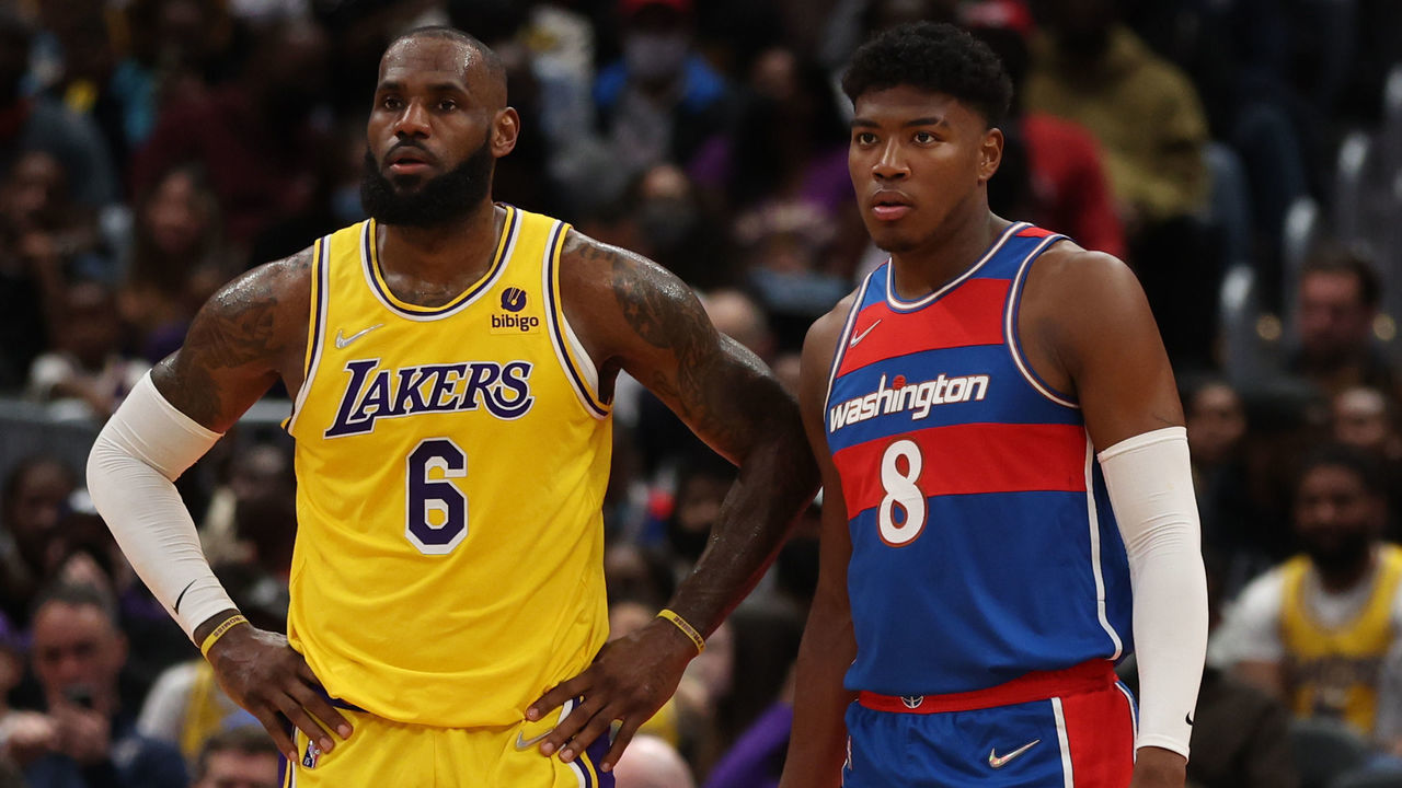 WASHINGTON, DC - MARCH 19: LeBron James #6 of the Los Angeles Lakers looks on next to Rui Hachimura #8 of the Washington Wizards during the first half at Capital One Arena on March 19, 2022 in Washington, DC.