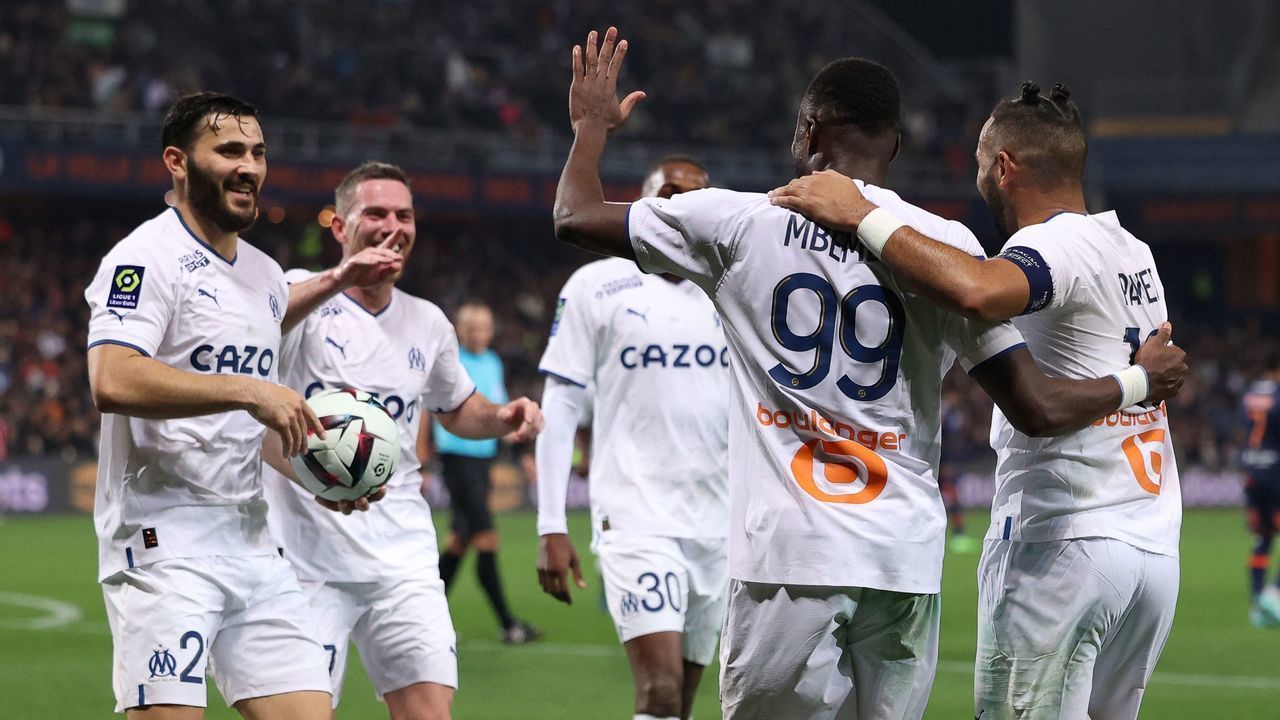 Marseille's Congolese defender Chancel Mbemba (2nd R) celebrates with teammates after scoring his team's second goal during the French L1 football match between Montpellier Herault SC and Olympique de Marseille (OM) at Stade de la Mosson in Montpellier, southern France, on January 2, 2023.