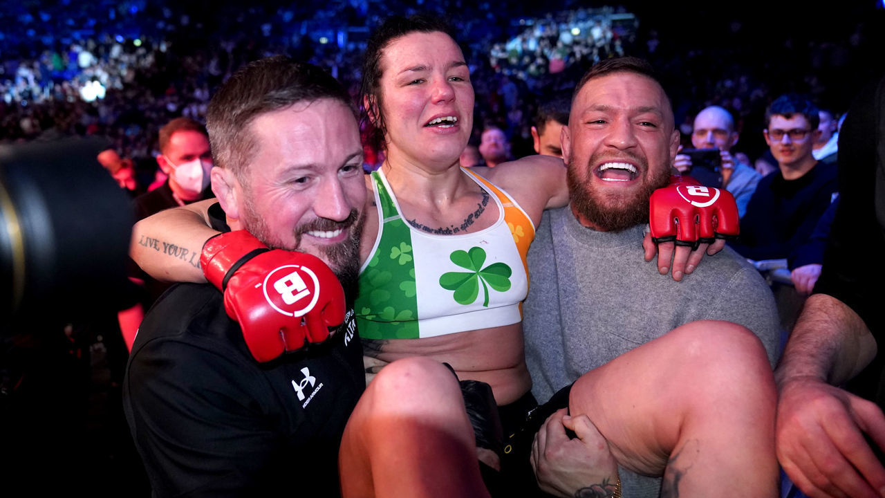 Sinead Kavanagh celebrates with Conor McGregor and coach John Kavanagh after beating Leah McCourt at 3Arena, Dublin. Picture date: Friday February 25, 2022.