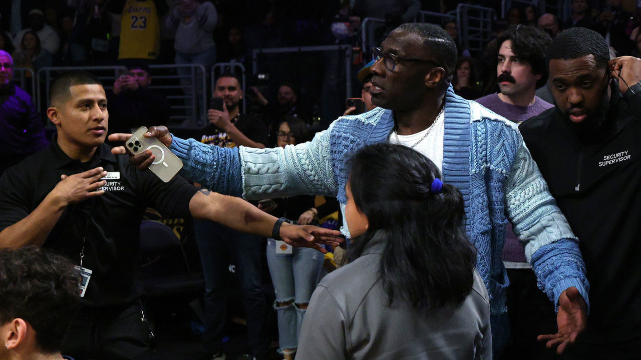 LOS ANGELES, CALIFORNIA - JANUARY 20: Shannon Sharpe is retrained by security from Ja Morant #12 of the Memphis Grizzlies after a verbal altercation following the end of the first half against the Los Angeles Lakers at Crypto.com Arena on January 20, 2023 in Los Angeles, California. NOTE TO USER: User expressly acknowledges and agrees that, by downloading and/or using this photograph, user is consenting to the terms and conditions of the Getty Images License Agreement.