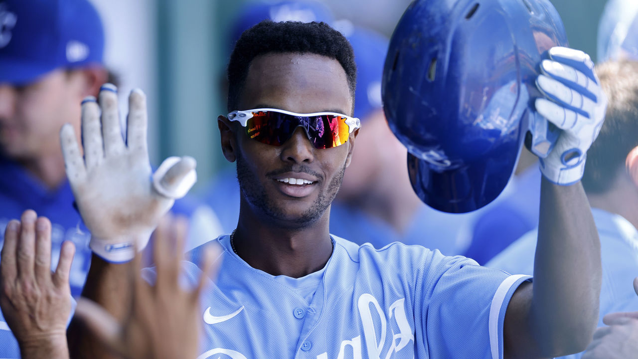 KANSAS CITY, MO - AUGUST 28: Kansas City Royals center fielder Michael A. Taylor (2) celebrates in the dugout after hitting a solo home run in the first inning of an MLB game against the San Diego Padres on August 28, 2022 at Kauffman Stadium in Kansas City, Missouri.