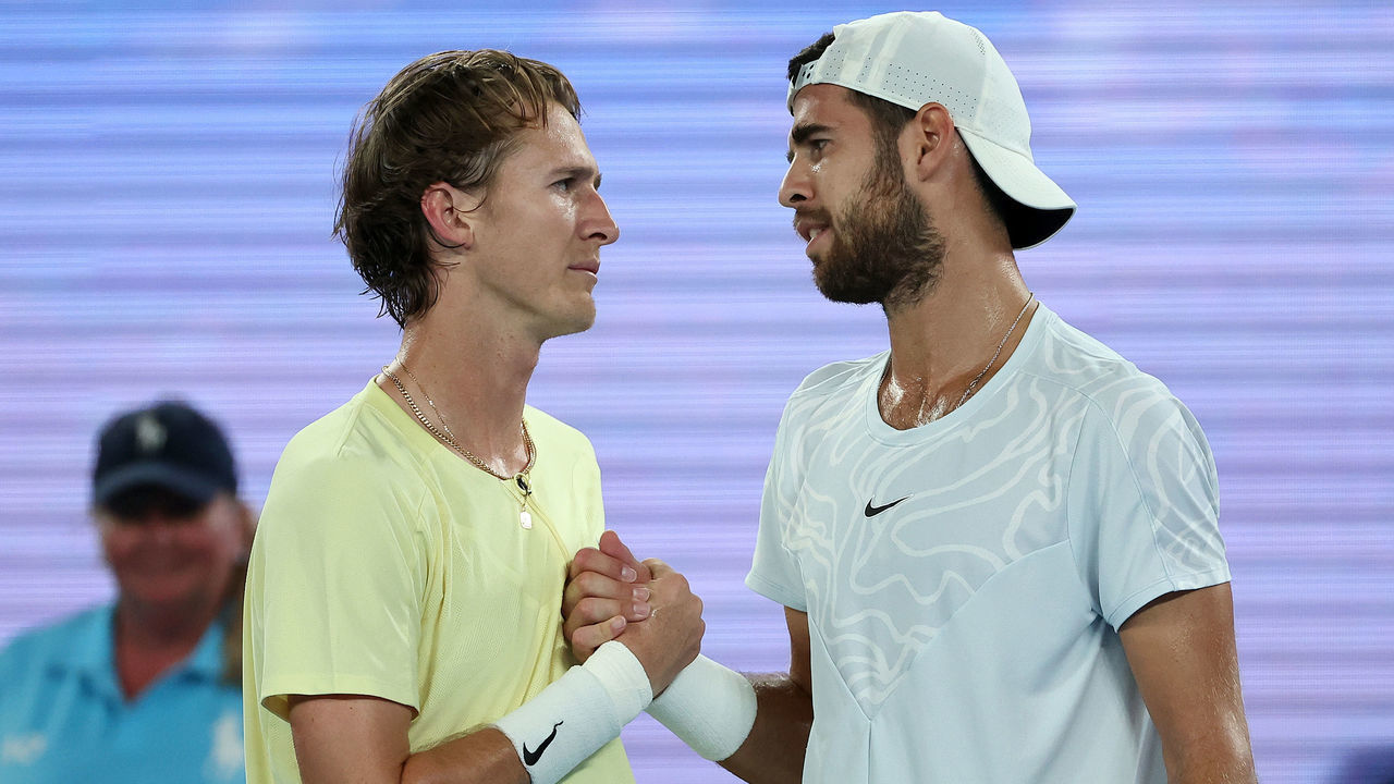 MELBOURNE, AUSTRALIA - JANUARY 24: Karen Khachanov of Russia and Sebastian Korda of the United States embrace at the net after the quarterfinal singles match during day nine of the 2023 Australian Open at Melbourne Park on January 24, 2023 in Melbourne, Australia.