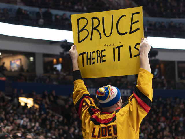 VANCOUVER, CANADA - JANUARY 21: A fan holds up a sign in support of Bruce Boudreau head coach of the Vancouver Canucks during NHL action between the Vancouver Canucks and the Edmonton Oilers on January, 21, 2023 at Rogers Arena in Vancouver, British Columbia, Canada.