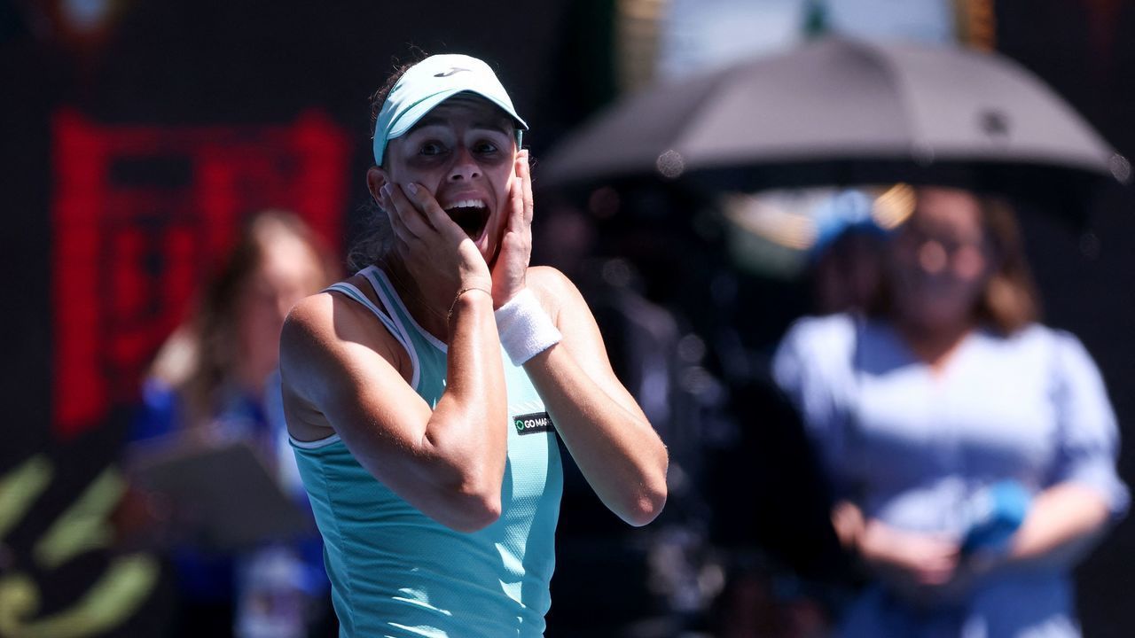 Poland's Magda Linette celebrates victory against Czech Republic's Karolina Pliskova during their women's singles quarter-final match on day ten of the Australian Open tennis tournament in Melbourne on January 25, 2023. - -- IMAGE RESTRICTED TO EDITORIAL USE - STRICTLY NO COMMERCIAL USE --