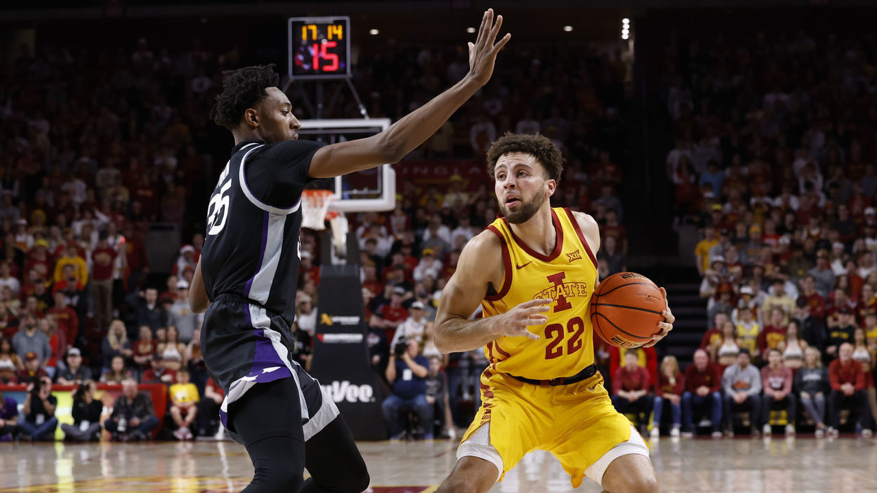 AMES, IA - JANUARY 24: Gabe Kalscheur #22 of the Iowa State Cyclones drives the ball as NaeQwan Tomlin #35 of the Kansas State Wildcats blocks in the first half of play at Hilton Coliseum on January 24, 2023 in Ames, Iowa.