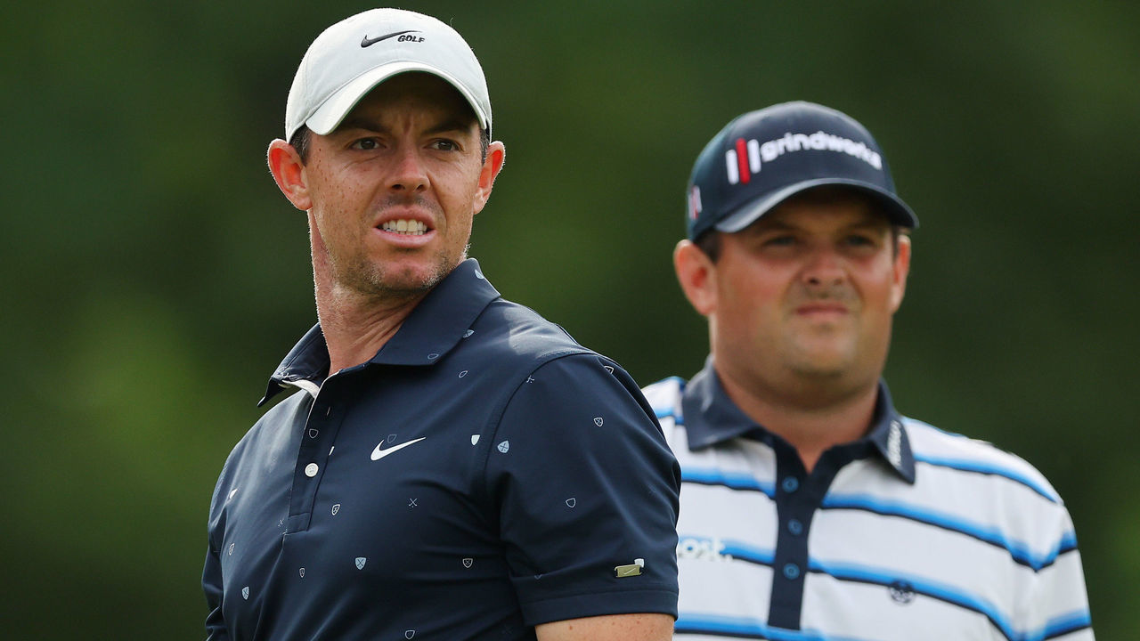 DUBLIN, OHIO - JUNE 02: Rory McIlroy of Northern Ireland and Patrick Reed of the United States look on on the 18th hole during the first round of the Memorial Tournament presented by Workday at Muirfield Village Golf Club on June 02, 2022 in Dublin, Ohio.