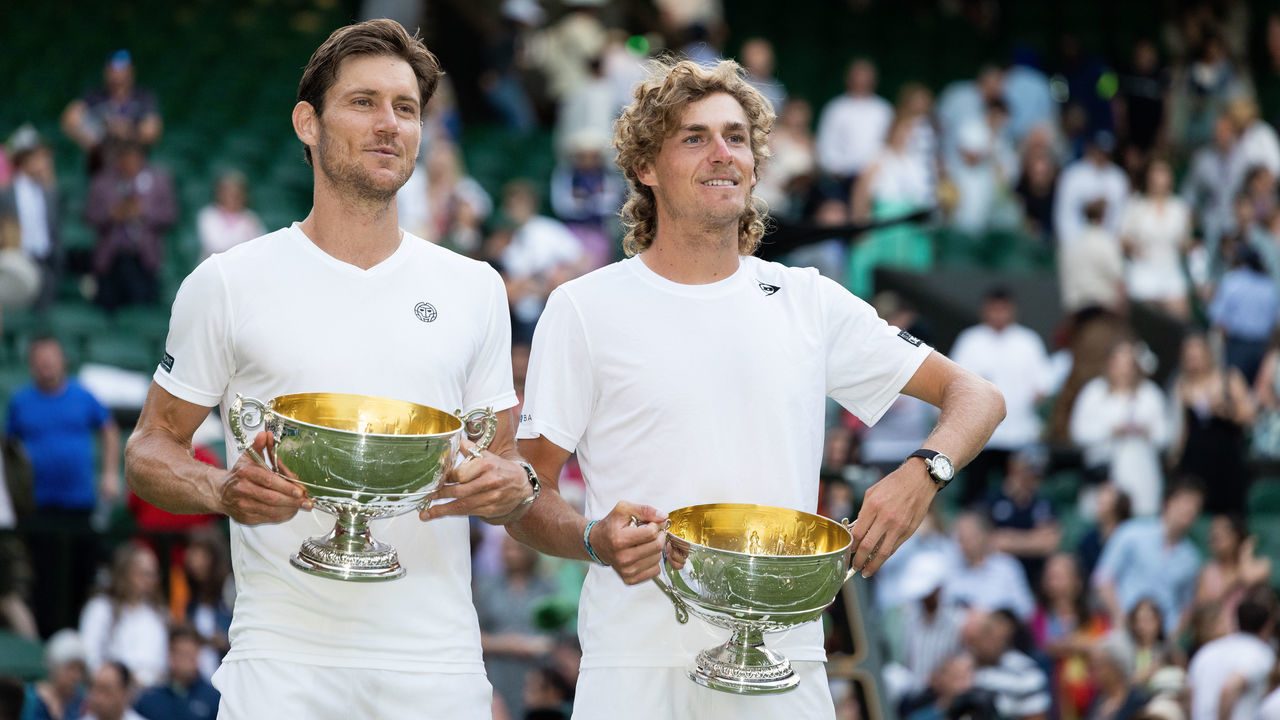 LONDON, ENGLAND - JULY 09: Matthew Ebden and Max Purcell both of Australia celebrate with their trophies after winning the Men's Doubles Final against Mate Pavic and Nikola Mektic both of Croatia (not pictured) at The Wimbledon Lawn Tennis Championship at the All England Lawn and Tennis Club at Wimbledon on July 9, 2022 in London, England.