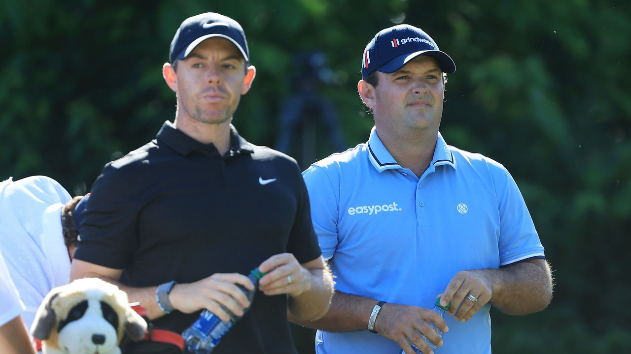 DUBLIN, OHIO - JUNE 03: Rory McIlroy of Northern Ireland and Patrick Reed of the United States look on from the 15th tree during the second round of the Memorial Tournament presented by Workday at Muirfield Village Golf Club on June 03, 2022 in Dublin, Ohio.