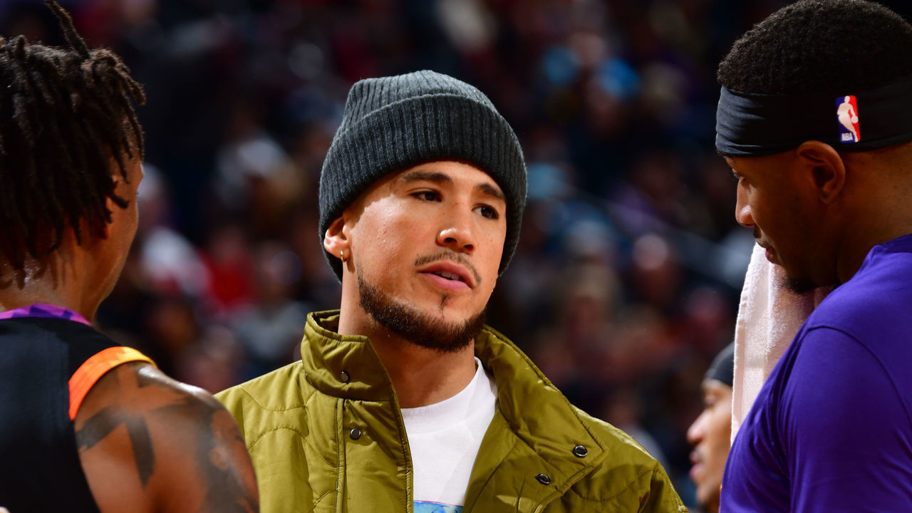 PHOENIX, AZ - JANUARY 19: Devin Booker #1 of the Phoenix Suns stands on the court during a timeout on January 19, 2023 at Footprint Center in Phoenix, Arizona. Mandatory Copyright Notice: Copyright 2023 NBAE .