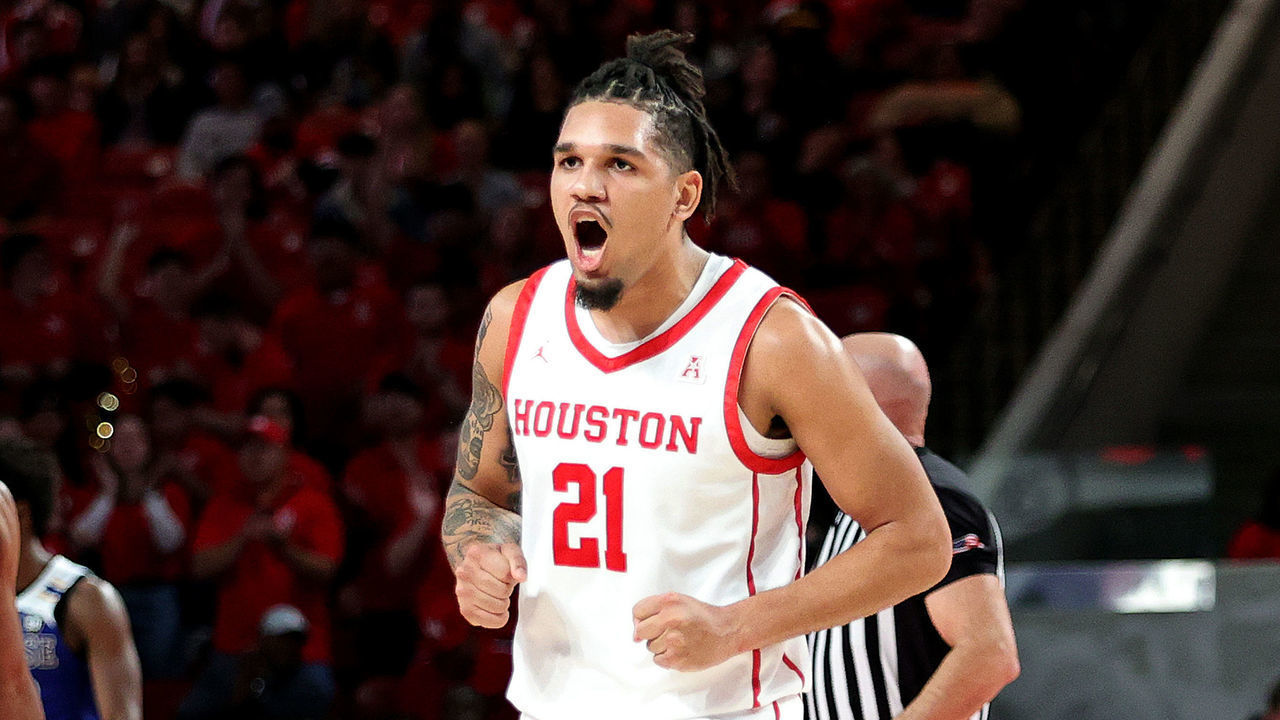 HOUSTON, TEXAS - DECEMBER 21: Emanuel Sharp #21 of the Houston Cougars reacts after making a three point basket against the McNeese State Cowboys at Fertitta Center on December 21, 2022 in Houston, Texas.