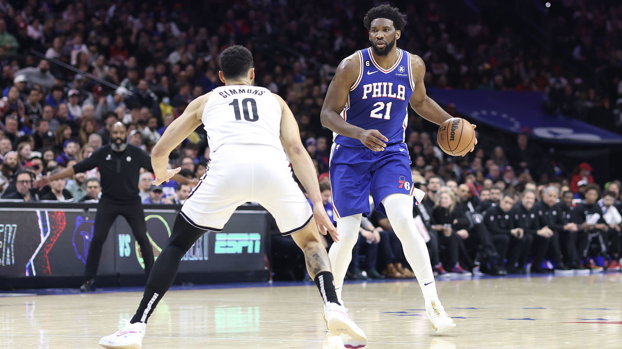 PHILADELPHIA, PENNSYLVANIA - JANUARY 25: Ben Simmons #10 of the Brooklyn Nets guards Joel Embiid #21 of the Philadelphia 76ers during the second quarter at Wells Fargo Center on January 25, 2023 in Philadelphia, Pennsylvania.
