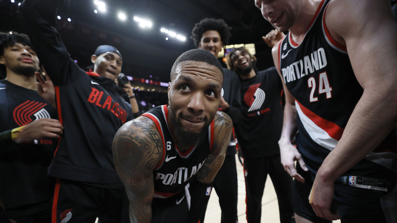 PORTLAND, OREGON - JANUARY 25: Damian Lillard #0 of the Portland Trail Blazers celebrates with teammates after a 134-124 victory over the Utah Jazz at Moda Center on January 25, 2023 in Portland, Oregon.