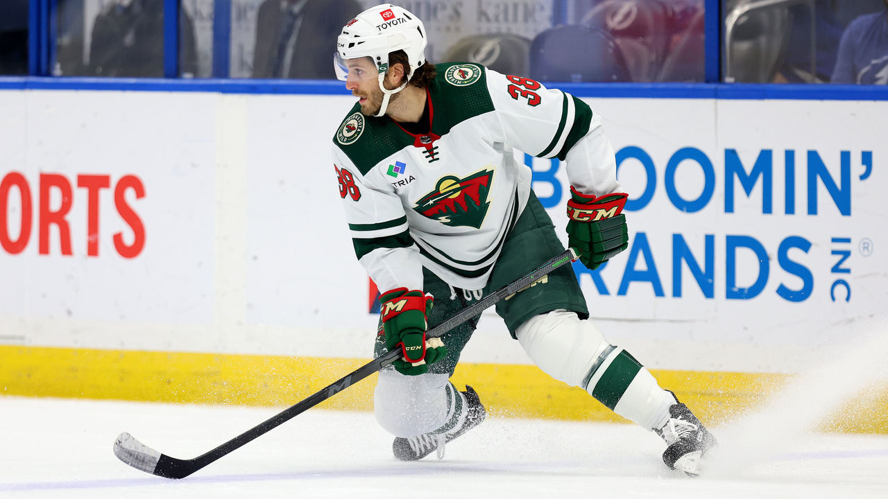 TAMPA, FLORIDA - JANUARY 24: Ryan Hartman #38 of the Minnesota Wild slooks to pass in the first period during a game against the Tampa Bay Lightning at Amalie Arena on January 24, 2023 in Tampa, Florida.
