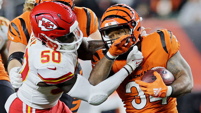 CINCINNATI, OHIO - DECEMBER 04: Willie Gay #50 of the Kansas City Chiefs tackles Samaje Perine #34 of the Cincinnati Bengals during the second half at Paycor Stadium on December 04, 2022 in Cincinnati, Ohio.