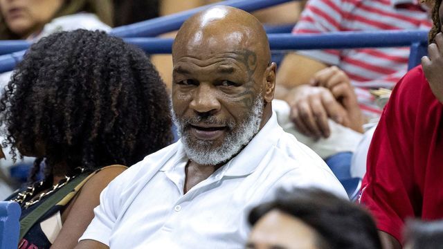 Former US professional bozer Mike Tyson (C) attends the 2022 US Open Tennis tournament men's singles third round match between Russia's Daniil Medvedev and China's Wu Yibing at the USTA Billie Jean King National Tennis Center in New York, on September 2, 2022.
