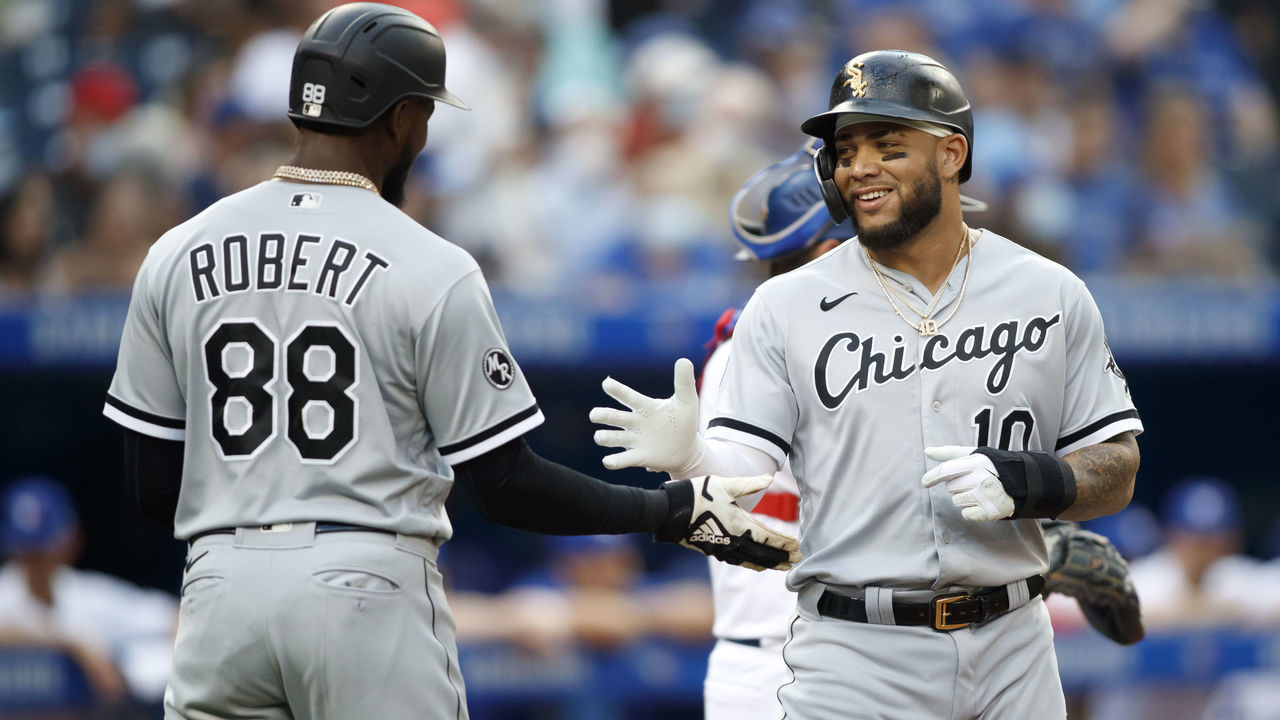 TORONTO, ON - AUGUST 24: Luis Robert #88 and Yoan Moncada #10 of the Chicago White Sox celebrate at home plate after Jose Abreu #79 hit them in on a three run home run in the first inning of their MLB game against the Toronto Blue Jays at Rogers Centre on August 24, 2021 in Toronto, Ontario.