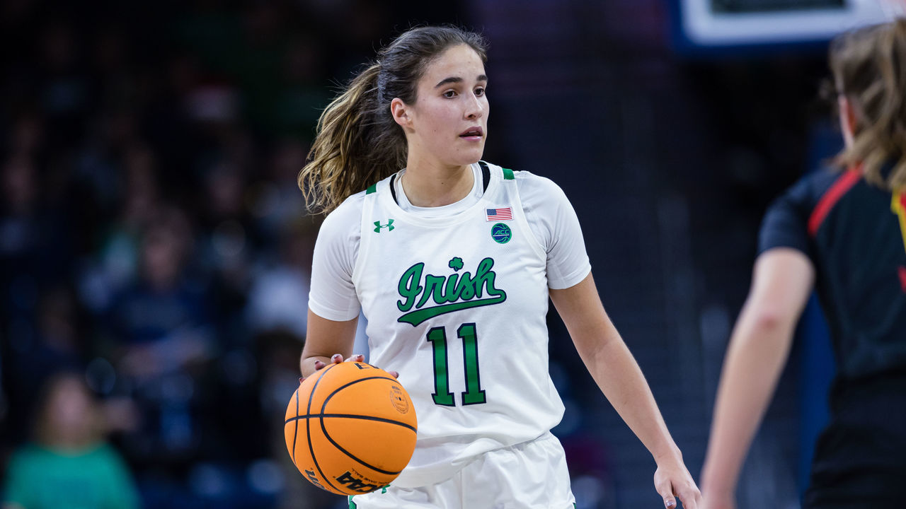 SOUTH BEND, IN - DECEMBER 01: Sonia Citron #11 of the Notre Dame Fighting Irish brings the ball up court during the game against the Maryland Terrapins at Joyce Center on December 1, 2022 in South Bend, Indiana.