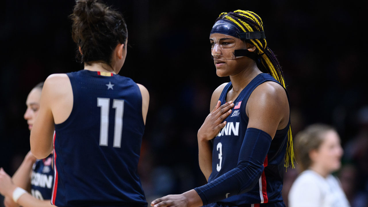 INDIANAPOLIS, IN - JANUARY 03: UConn Huskies forward Aaliyah Edwards (3) talks to UConn Huskies forward Lou Lopez Sénéchal (11) on the court during the women's college basketball game between the Butler Bulldogs and UConn Huskies on January 3, 2023, at Hinkle Fieldhouse in Indianapolis, IN.