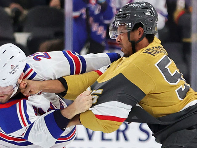 LAS VEGAS, NEVADA - DECEMBER 07: Barclay Goodrow #21 of the New York Rangers and Keegan Kolesar #55 of the Vegas Golden Knights fight in the second period of their game at T-Mobile Arena on December 07, 2022 in Las Vegas, Nevada.