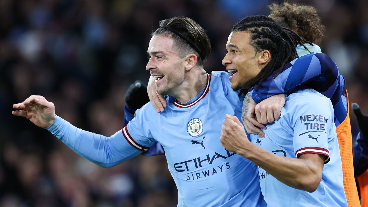 MANCHESTER, ENGLAND - JANUARY 27: Nathan Ake of Manchester City celebrates with Jack Grealish after scoring his side's first goal during the Emirates FA Cup Fourth Round match between Manchester City and Arsenal at Etihad Stadium on January 27, 2023 in Manchester, England.