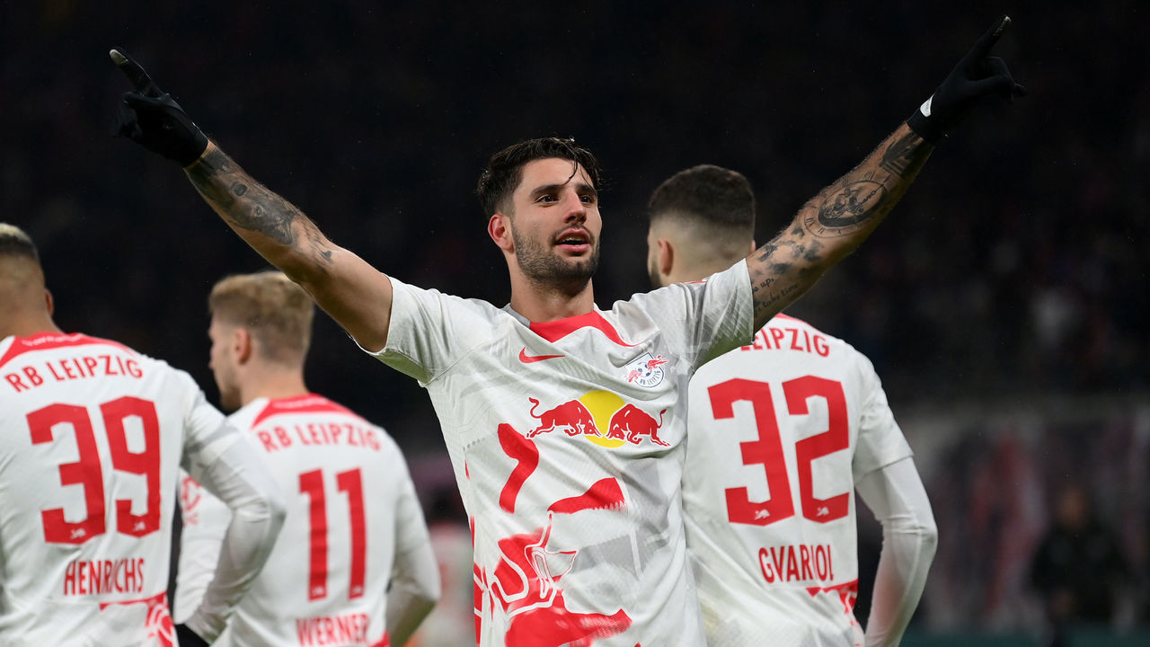 LEIPZIG, GERMANY - JANUARY 27: Dominik Szoboszlai of RB Leipzig celebrates after scoring the team's second goal with teammates during the Bundesliga match between RB Leipzig and VfB Stuttgart at Red Bull Arena on January 27, 2023 in Leipzig, Germany.