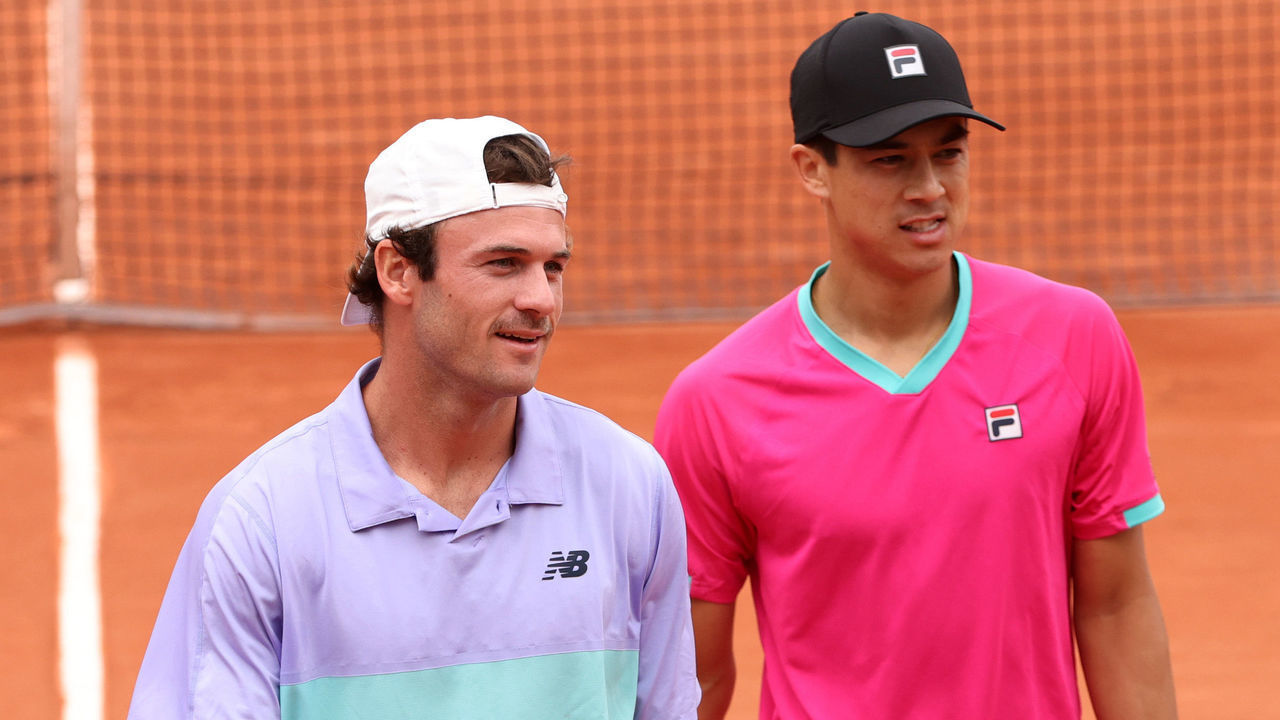 PARIS, FRANCE - MAY 27: Tommy Paul of The United States (L) interacts with partner Mackenzie Mcdonald of The United States against Bruno Soares of Brazil and Jamie Murray of Great Britain during the Men's Doubles Second Round match on Day 6 of The 2022 French Open at Roland Garros on May 27, 2022 in Paris, France.