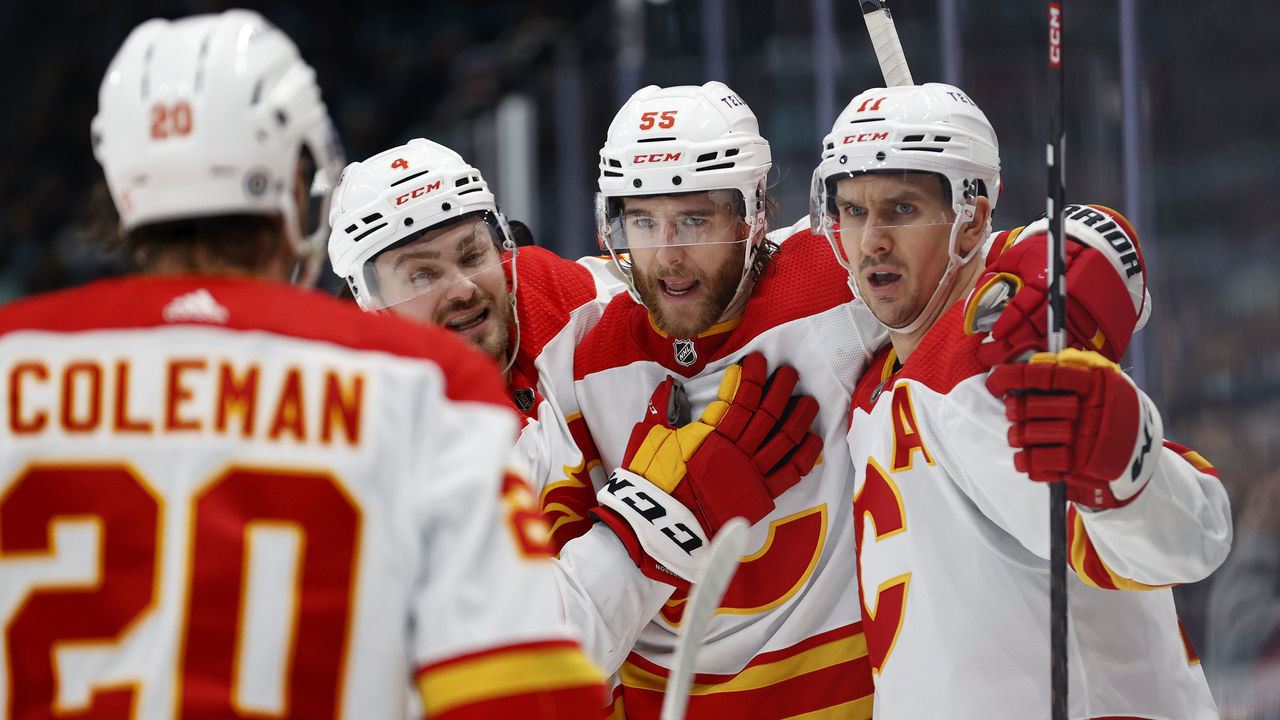 SEATTLE, WASHINGTON - JANUARY 27: Noah Hanifin #55 of the Calgary Flames celebrates his goal against the Seattle Kraken during the third period at Climate Pledge Arena on January 27, 2023 in Seattle, Washington.