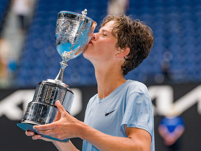 MELBOURNE, AUSTRALIA - JANUARY 28: Alexander Blockx of Belgium poses with the championship trophy after winning the Junior Boys’ Singles Final against Learner Tien of the United States during day 13 of the 2023 Australian Open at Melbourne Park on January 28, 2023 in Melbourne, Australia