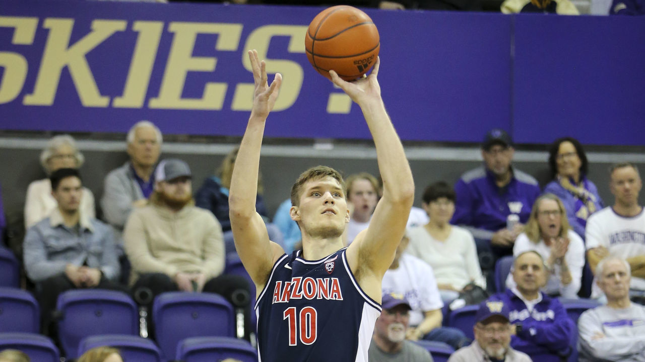 SEATTLE, WA - JANUARY 28: Arizona Wildcats forward Azuolas Tubelis (10) shoots a three point shot during a college basketball game between the Arizona Wildcats and the Washington Huskies on January 28, 2023, at Hec Edmundson Pavilion in Seattle, WA