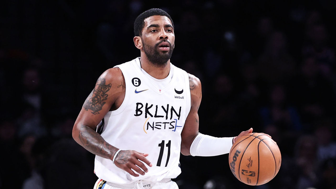 NEW YORK, NEW YORK - JANUARY 28: Kyrie Irving #11 of the Brooklyn Nets brings the ball up the court during the first quarter of the game against the New York Knicks at Barclays Center on January 28, 2023 in New York City.