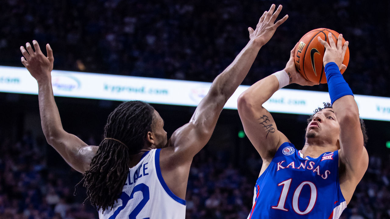 LEXINGTON, KY - JANUARY 28: Jalen Wilson #10 of the Kansas Jayhawks shoots the ball against Cason Wallace #22 of the Kentucky Wildcats during the first half at Rupp Arena on January 28, 2023 in Lexington, Kentucky.