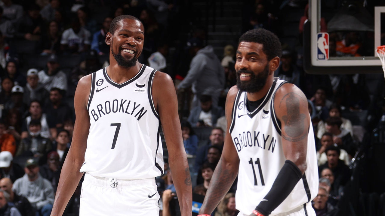 BROOKLYN, NY - OCTOBER 3: Kevin Durant #7 and Kyrie Irving #11 of the Brooklyn Nets smile during a preseason game on against the Philadelphia 76ers October 3, 2022 at Barclays Center in Brooklyn, New York. Mandatory Copyright Notice: Copyright 2022 NBAE