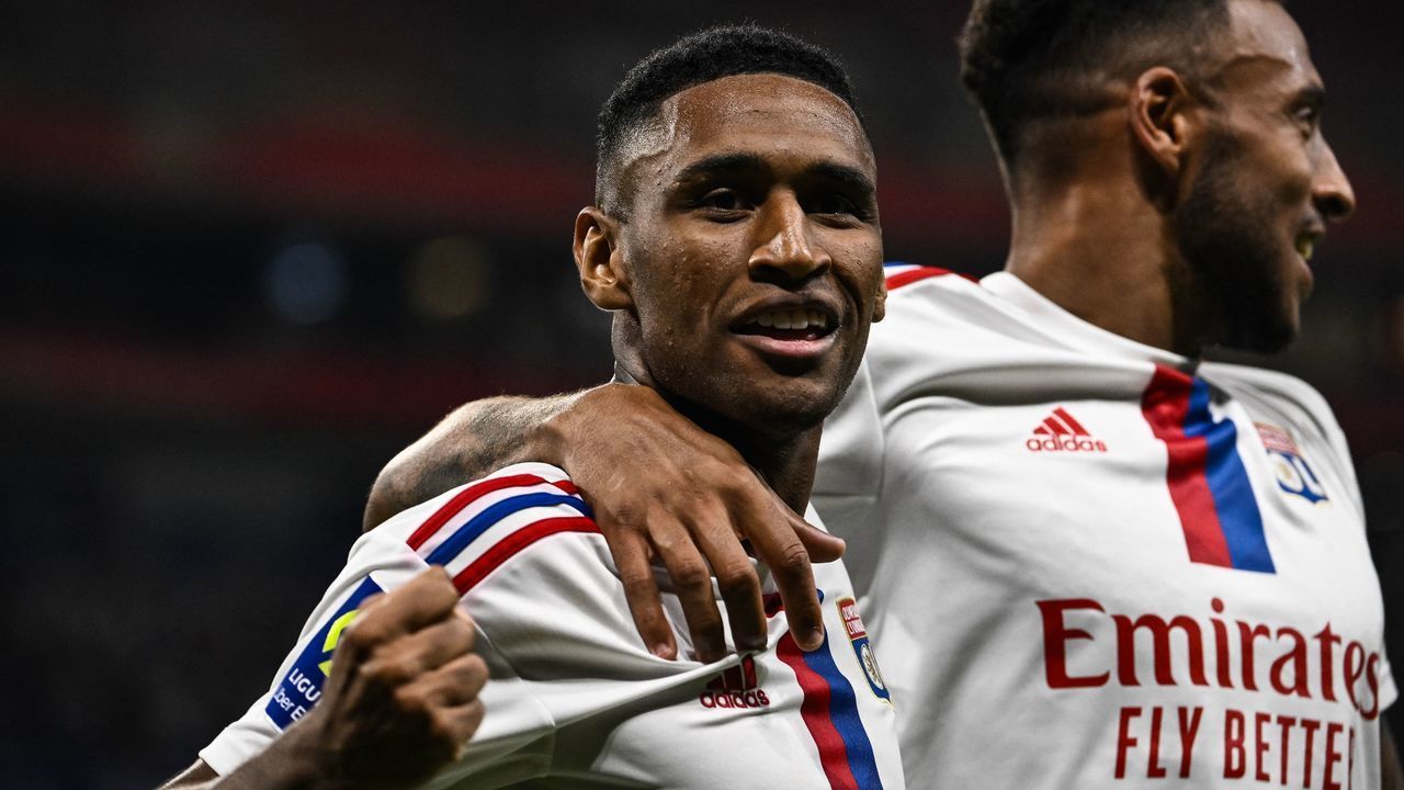 Lyons Brazilian forward Tete (L) celebrates with teammate after scoring his team's third goal during the French L1 football match between Olympique Lyonnais (OL) and ES Troyes AC at The Groupama Stadium in Decines-Charpieu, central-eastern France on August 19, 2022.