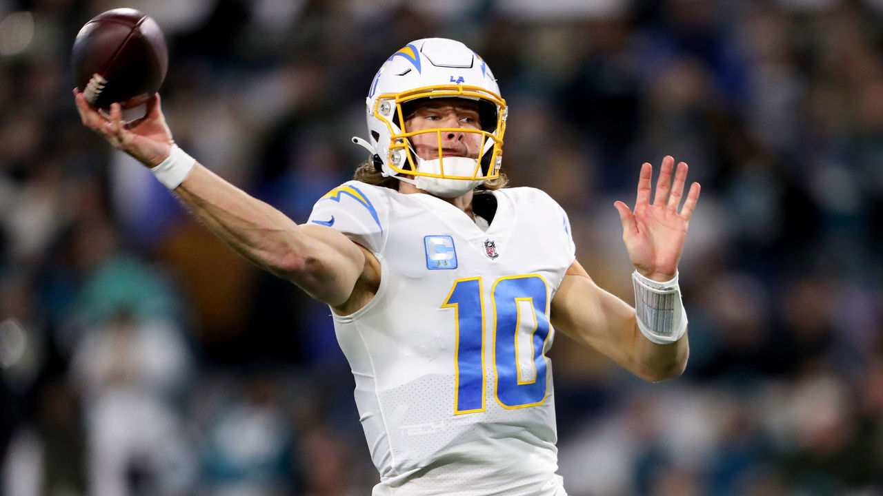 JACKSONVILLE, FLORIDA - JANUARY 14: Justin Herbert #10 of the Los Angeles Chargers throws a pass against the Jacksonville Jaguars during the first half of the game in the AFC Wild Card playoff game at TIAA Bank Field on January 14, 2023 in Jacksonville, Florida.