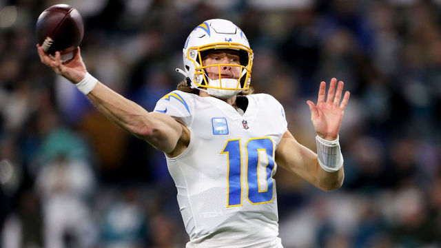 JACKSONVILLE, FLORIDA - JANUARY 14: Justin Herbert #10 of the Los Angeles Chargers throws a pass against the Jacksonville Jaguars during the first half of the game in the AFC Wild Card playoff game at TIAA Bank Field on January 14, 2023 in Jacksonville, Florida.