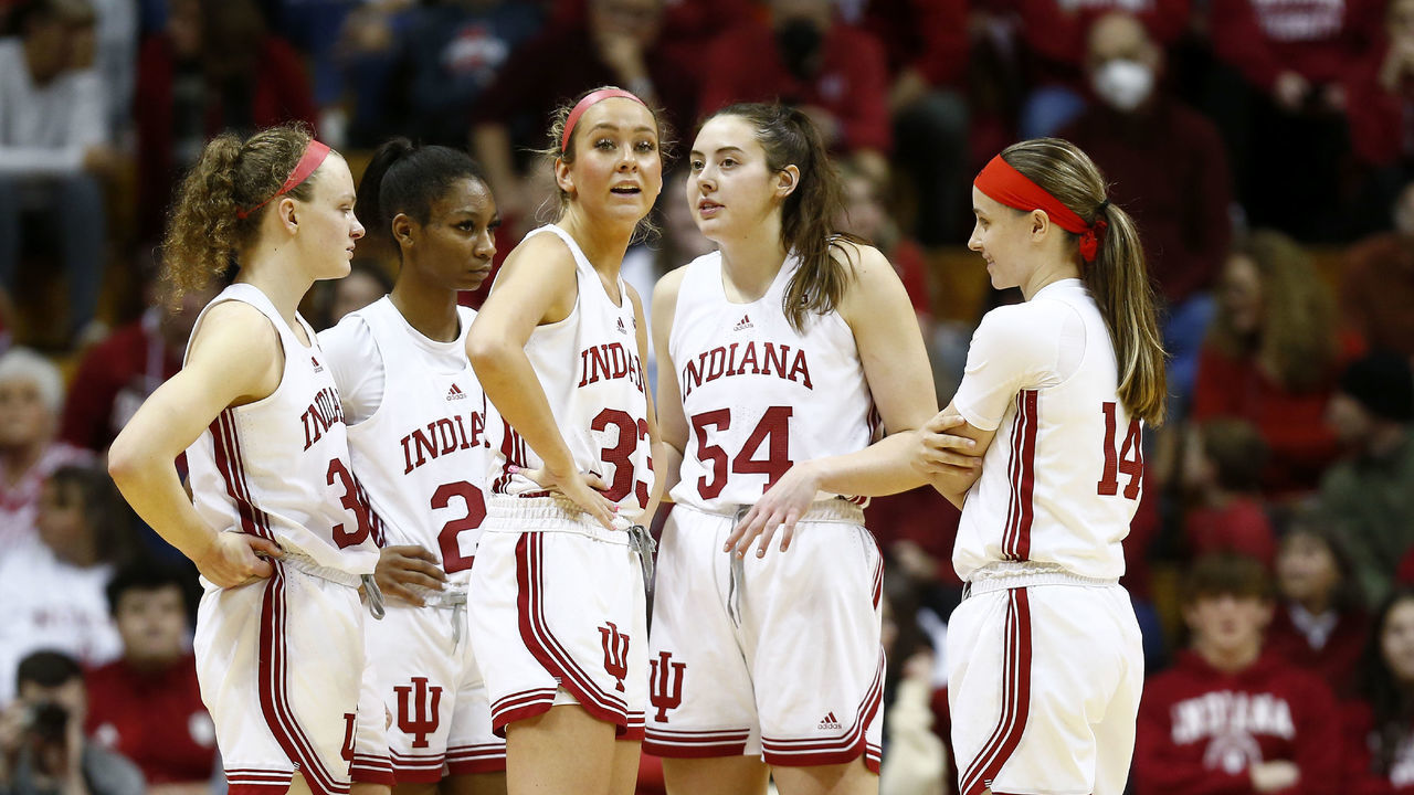 BLOOMINGTON, IN - JANUARY 29: Indiana Hoosiers guard Sydney Parrish (33), Indiana Hoosiers guard Grace Berger (34), Indiana Hoosiers forward Mackenzie Holmes (54) and Indiana Hoosiers guard Sara Scalia (14) huddle up during a break in the action during a womens college basketball game between the Rutgers Scarlet Knights and the Indiana Hoosiers on January 29, 2023 at Simon Skjodt Assembly Hall, in Bloomington, IN.